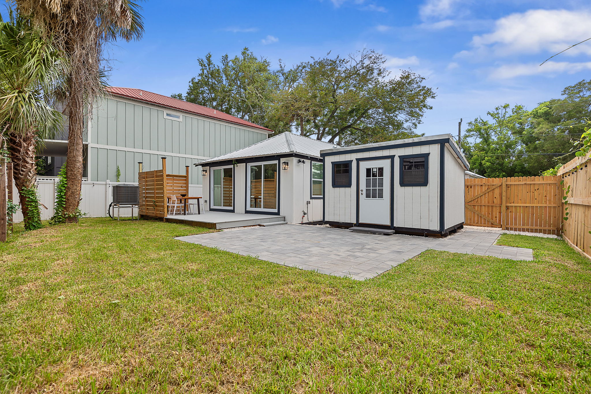 Rear yard with patio, deck, and privacy fence