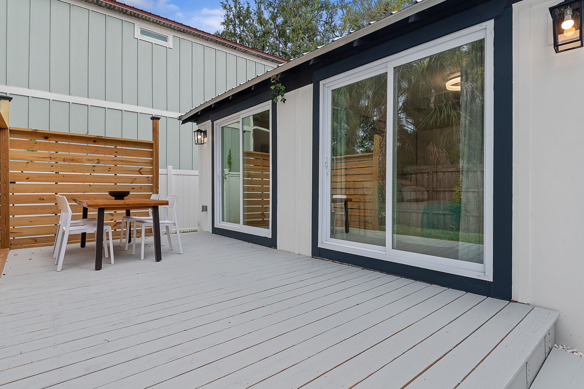 Covered deck and sliding glass doors off the primary bedroom